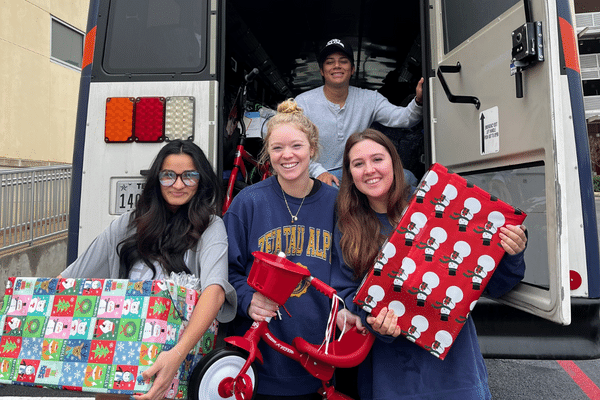 students filling the bus for Adopt a Family